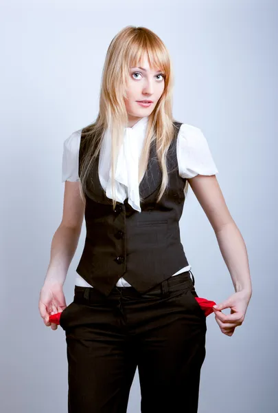 Young business woman showing empty pockets — Stock Photo, Image