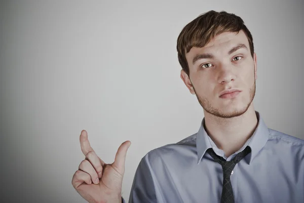 Young businessman showing size — Stock Photo, Image