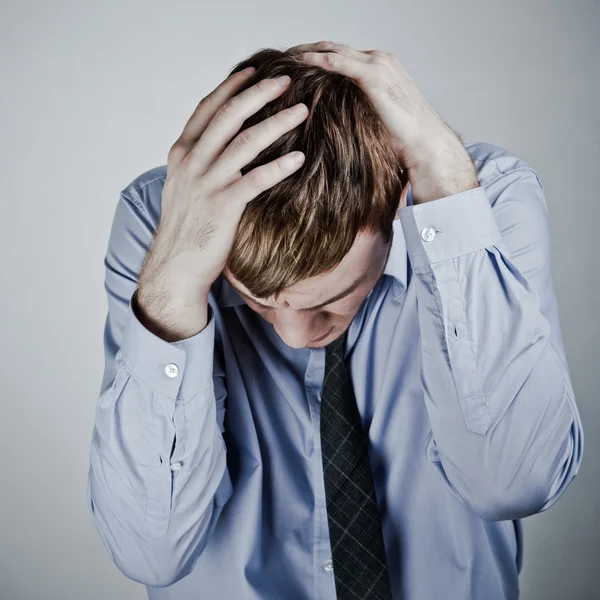 Businessman with a big headache — Stock Photo, Image