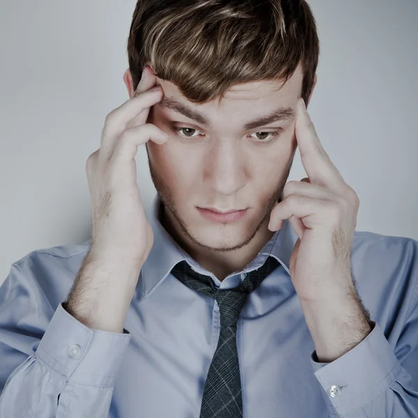 Portrait of stressed businessman with headache — Stock fotografie