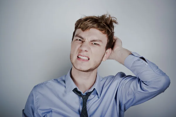 Portrait of stressed businessman with headache — Stock Photo, Image