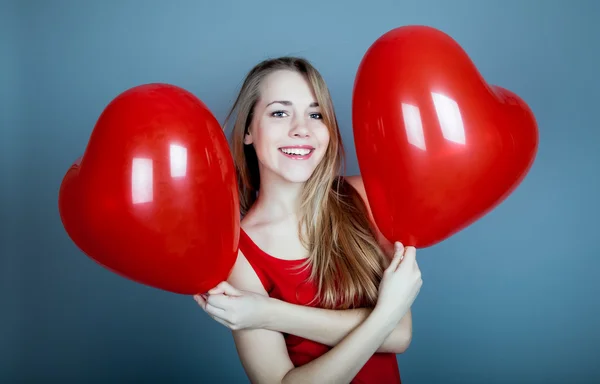 Girl with red hearts — Stock Photo, Image