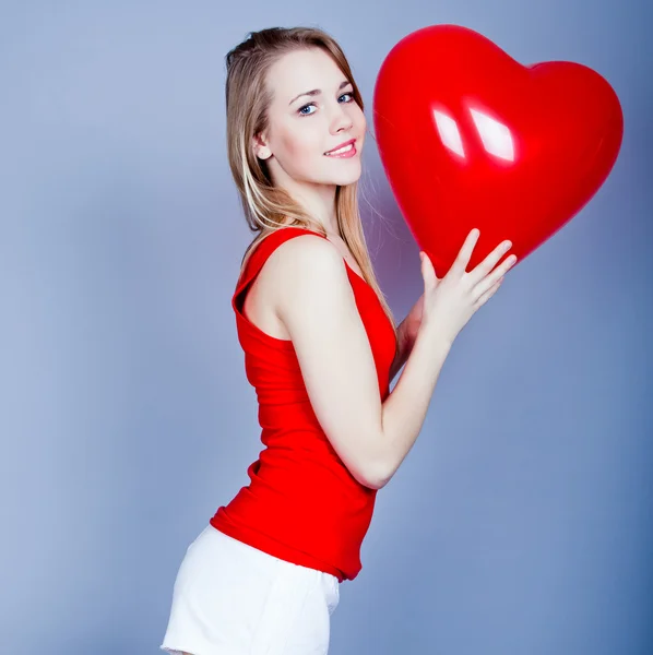 Valentines day woman holding red heart balloon. — Stock Photo, Image