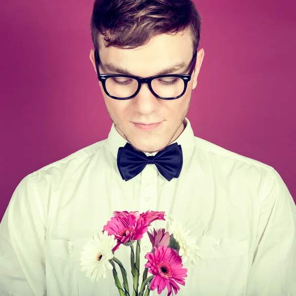 Shy man with a bouquet of flowers — Stock Photo, Image