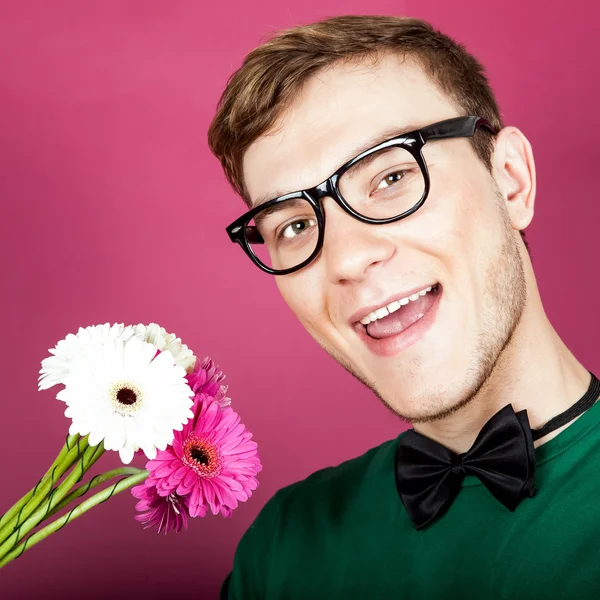 stock image Young smiling man holding a bouquet of flowers