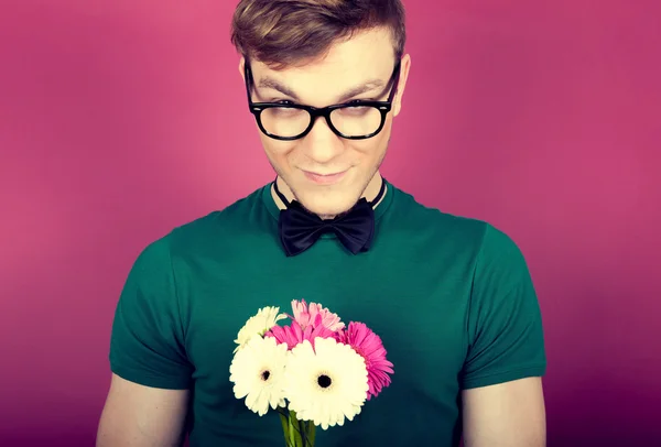 Shy man with a bouquet of flowers — Stock Photo, Image