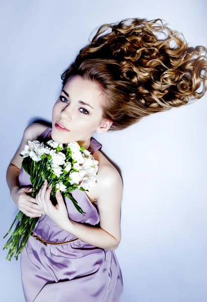 Elegant fashionable woman with flowers — Stock Photo, Image