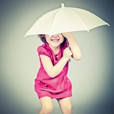 Funny little girl with umbrella clipart