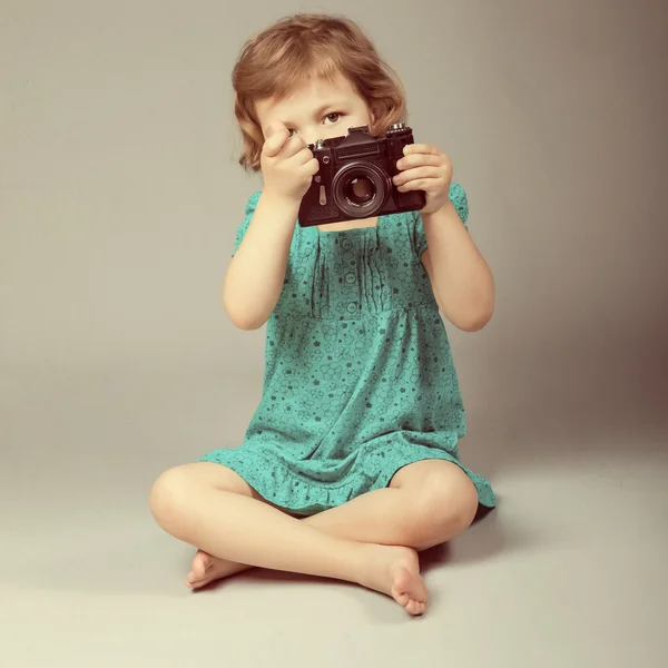 stock image Portrait of baby girl holding photo camera