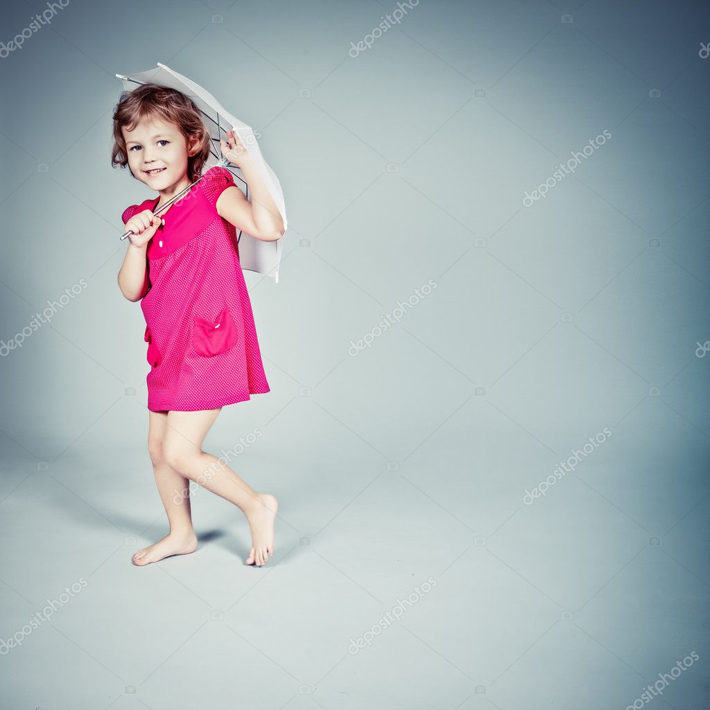 Little Girl standing with umbrella Stock Photo by ©Porechenskaya 9904887