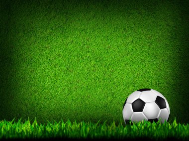 Football in green grass clipart