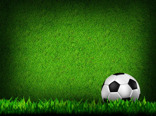 Football in green grass — Stock Photo, Image