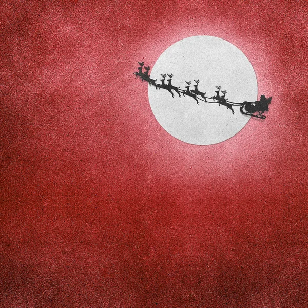 Санта-Клаус на санях з оленів і місяць відновлений паперового — стокове фото