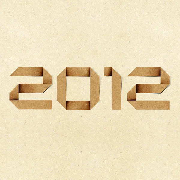 Mutlu yeni yıl 2011 geri dönüştürülmüş kağıt tekne arka plan. — Stok fotoğraf