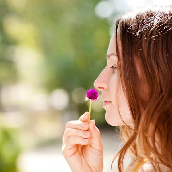 Woman with spring flower — Stock Photo, Image