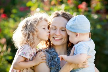 Happy woman with child and baby clipart