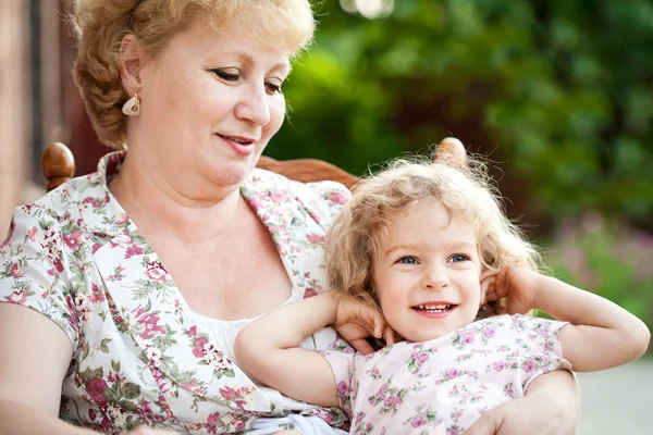 Happy grandchild with grandmother — Stock Photo, Image