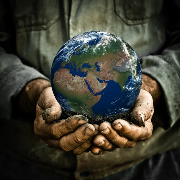 Man holding Earth — Stockfoto