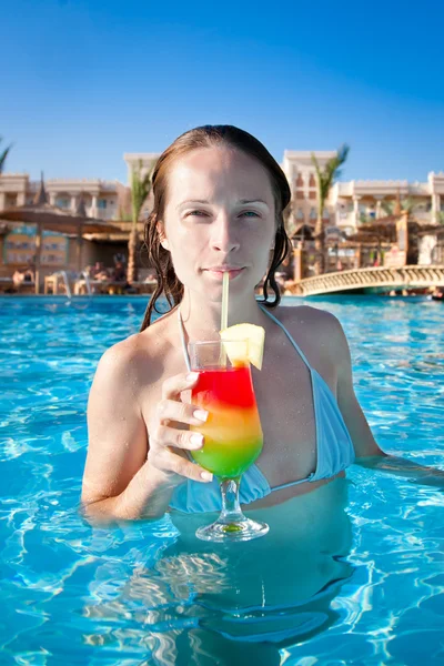 Woman drinking a fruit cocktail — Stock Photo, Image