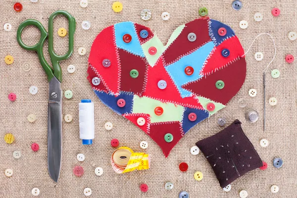 Sewing accessories and fabric scraps heart — Stock Photo, Image
