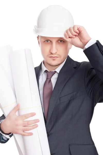 Engineer wearing white hardhat with blueprints isolated on white — Stockfoto