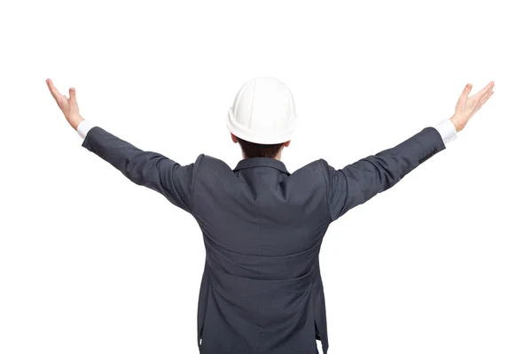 Інженер, стоячи позаду, тримає руки вгору ізольовано на білому — стокове фото