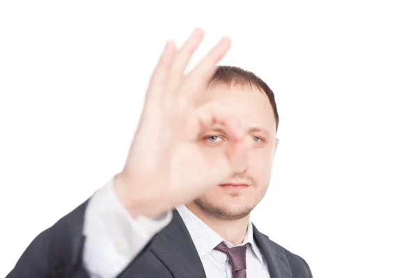 Young businessman showing symbol OK isolated on white background — Stock Photo, Image