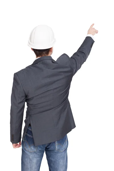 Engineer standing back view pointing something isolated on white — Stock Photo, Image