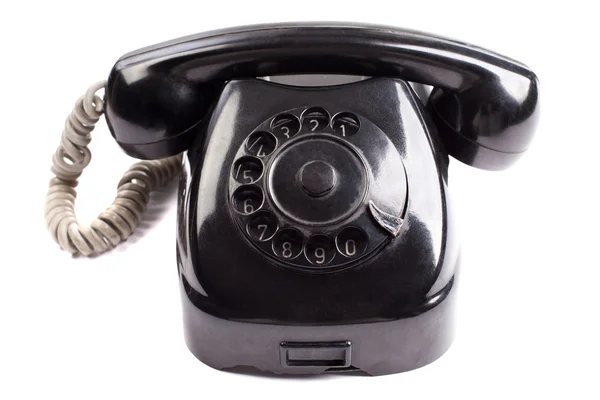 Oude zwarte telefoon op witte achtergrond — Stockfoto