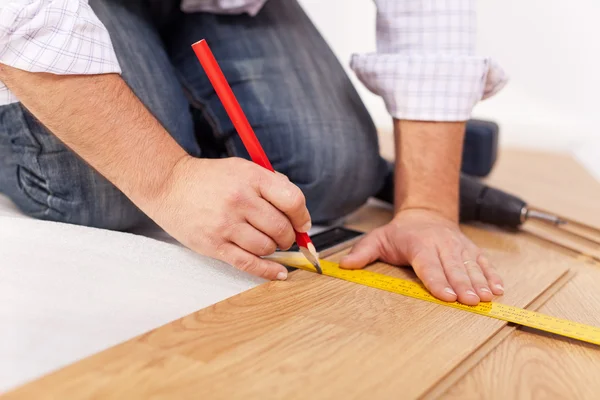 Home improvment - laying laminate flooring — Stock Photo, Image