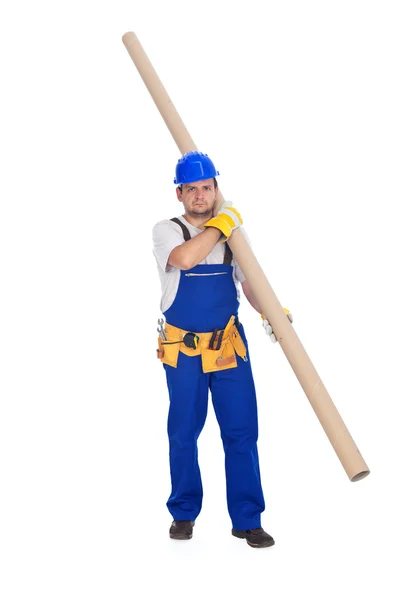 Handyman or worker carrying pipe — Stock Photo, Image