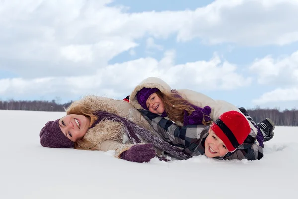 Family having fun in the snow — Stock Photo, Image