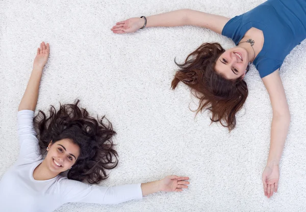 Happy frame - teenagers laying on the floor — Stock Photo, Image