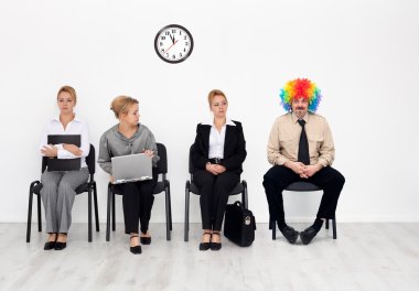 There's one in every crowd - clown among job candidates clipart