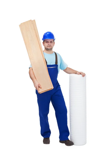 Werknemer met materialen van de Bevloering — Stockfoto