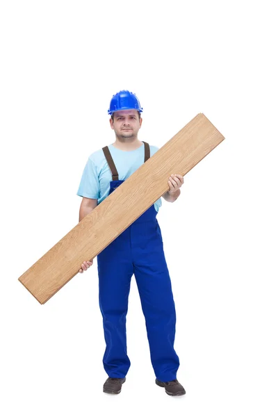 Worker carrying laminate flooring — Stock Photo, Image