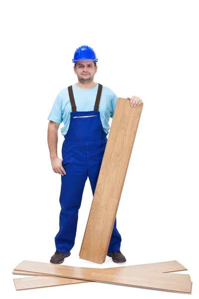 Worker with laminate flooring — Stock Photo, Image