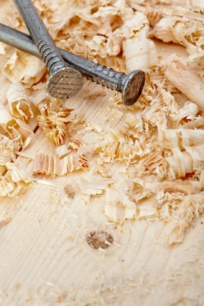 Nails and wood shavings — Stock Photo, Image