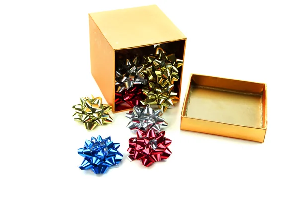 Box of small bows on white background — Stock Photo, Image