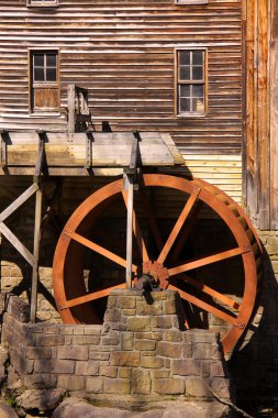 Rustic Wheel On Water Mill clipart