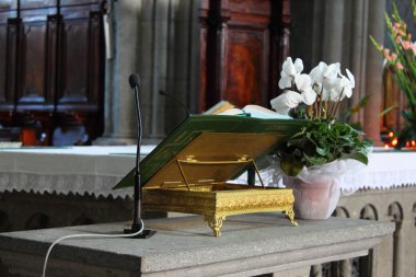 Open Bible on an altar clipart