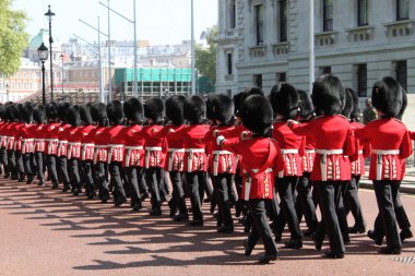 Royal Guards march toward Buckingham Palace clipart