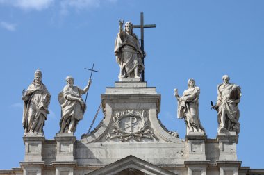 Statues on the top of Saint John Lateran Basilica clipart