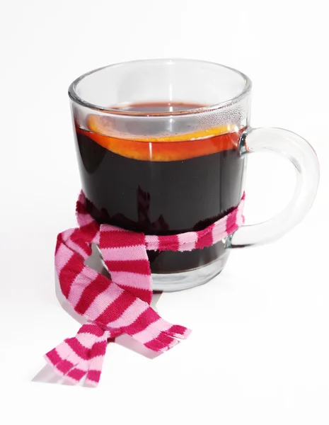 Cup of winter drink wrapped in scarf — Stock Photo, Image