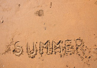 Handwritten summer on beach sand at sunset clipart