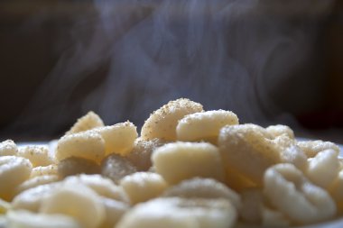 Fresh cooked steaming gnocchi clipart