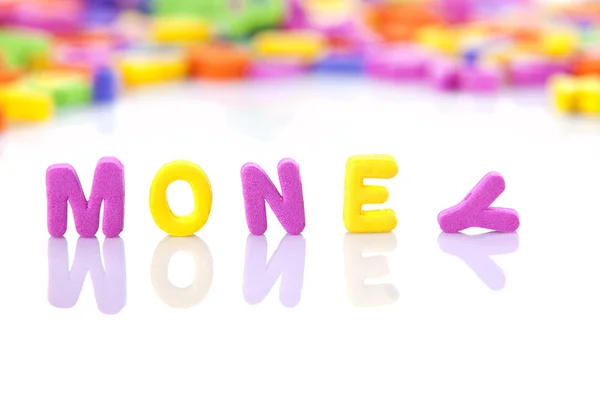 MONEY написана игрушечными буквами — стоковое фото