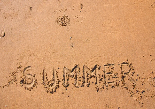 stock image Handwritten summer on beach sand at sunset