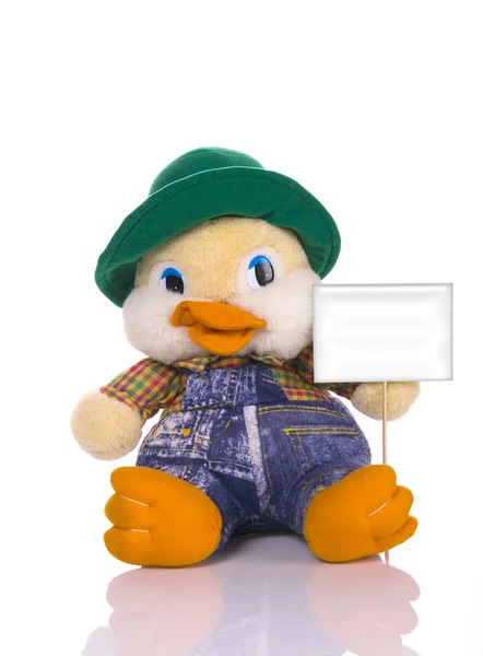 Pato de brinquedo segurando uma etiqueta em branco — Fotografia de Stock