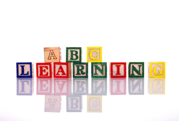 Wooden blocks with letters Education toy concept — Stock Photo, Image
